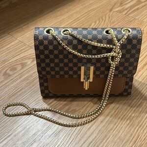 Brown purse with chain shoulder strap